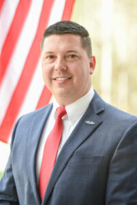 Gold Hole Sponsor - Representative Travis Moore - Logo